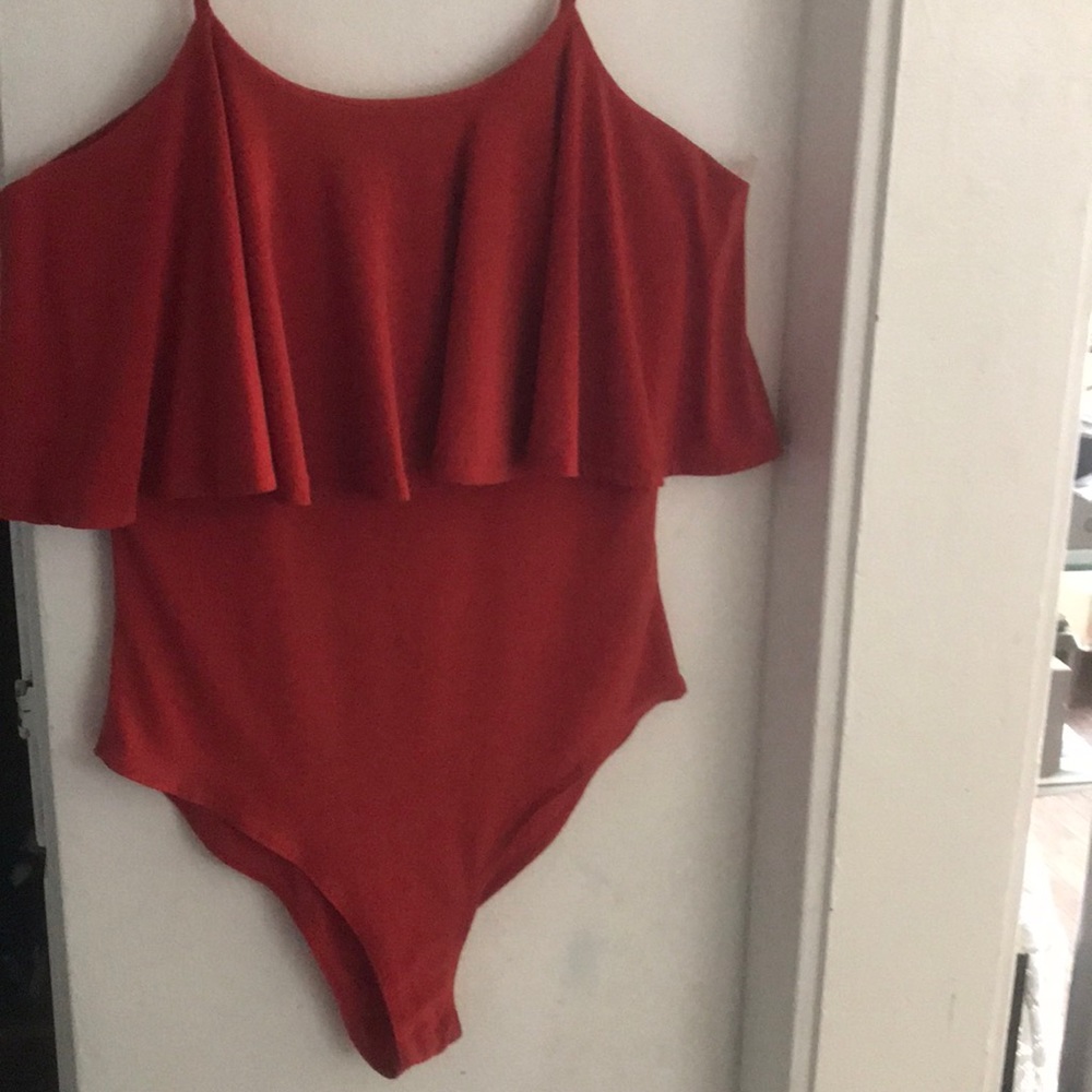 A orangey bodysuit